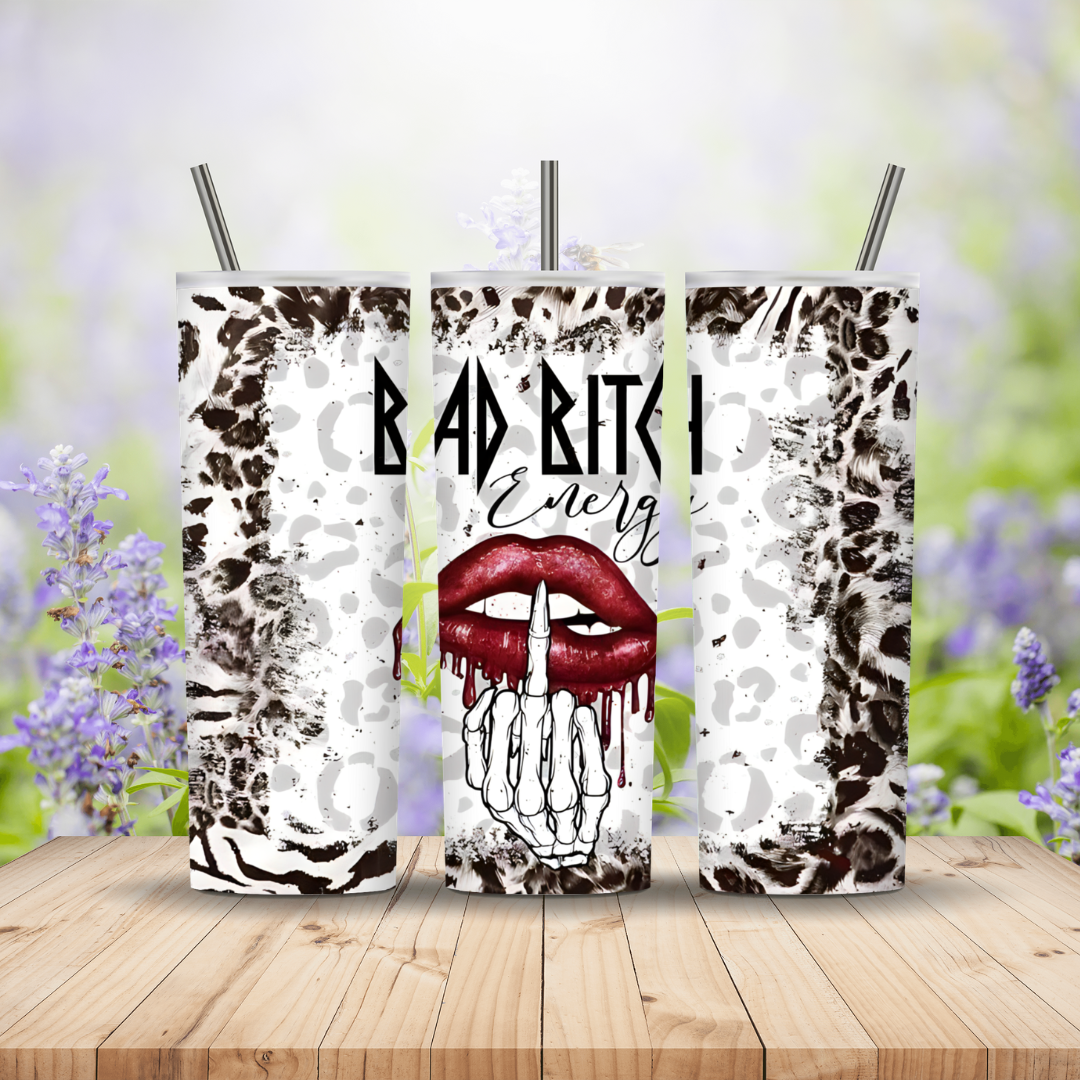 animal print three tumblers with red lip and a skeleton hand on a wooden background
