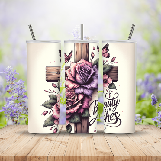 Three tumblers with floral designs and text on a wooden surface with blurred flowers in the background Miss Mafia