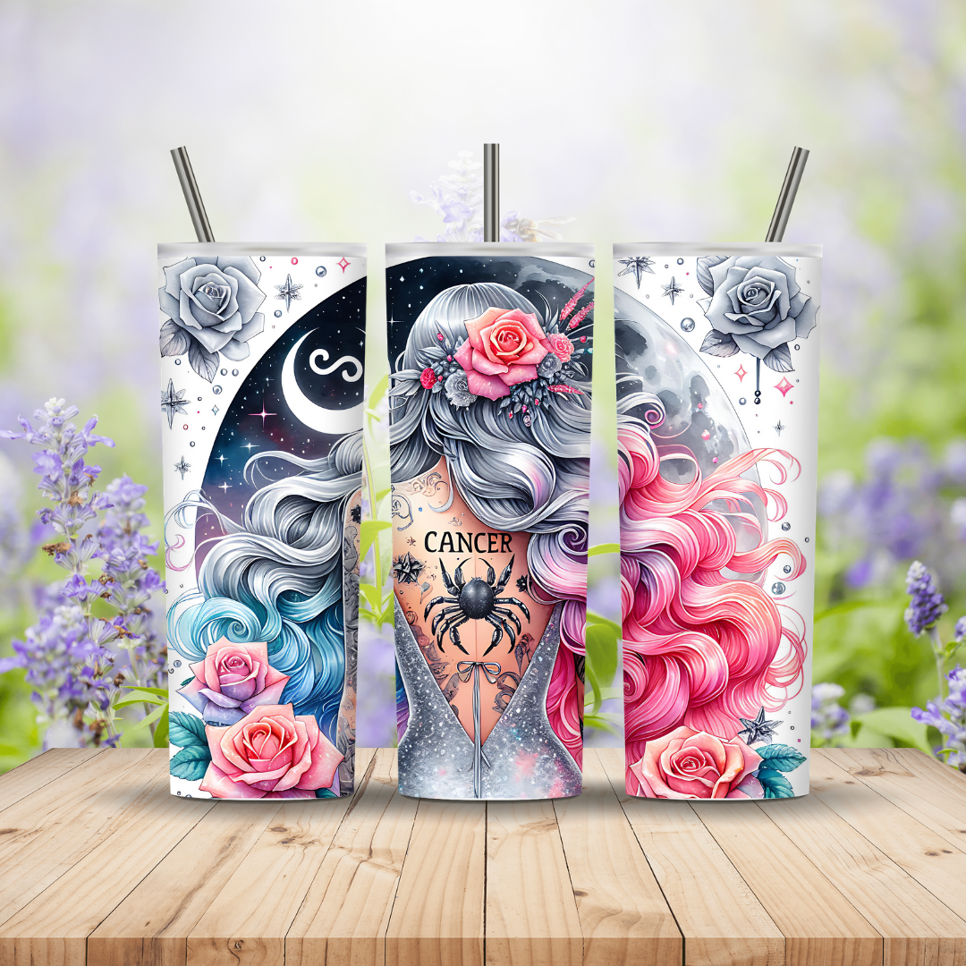 Three tumbler designs with astrological theme on a wooden surface with blurred floral background