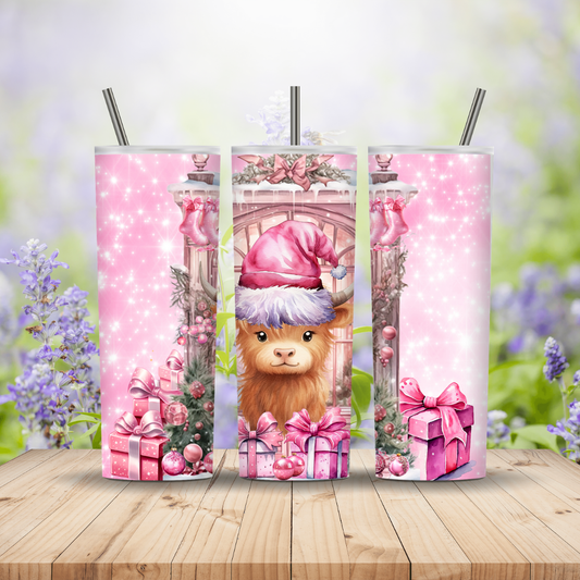 Three pink tumblers with a llama design on a wooden surface with a floral background
