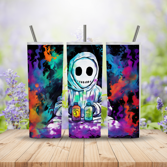 Three colorful tumblers with a skeleton design on a wooden surface with a blurred floral background.