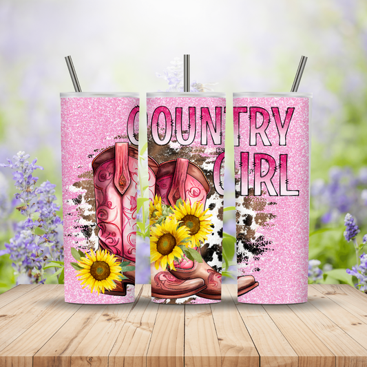 Three pink tumblers with 'Country Girl' design featuring boots and sunflowers on a wooden surface with a blurred floral background.