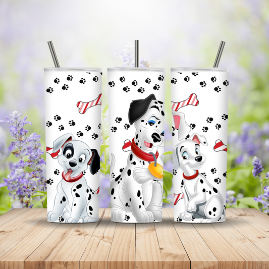 Three tumblers with Dalmatian dog designs on a wooden surface with a blurred floral background. Miss Mafia