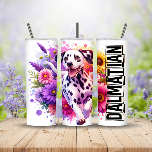 Three tumblers with floral and Dalmatian designs on a wooden surface with a blurred floral background. Miss Mafia