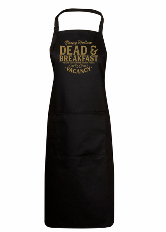 Black apron with gold text on a white background
