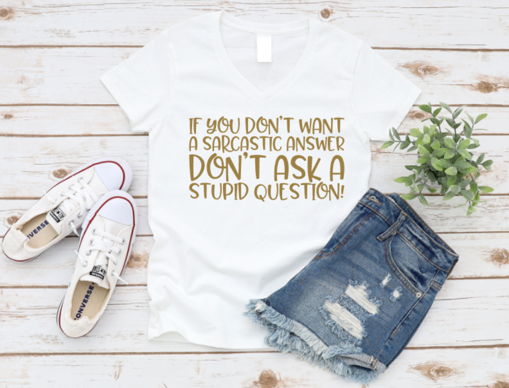White t-shirt with humorous text, denim shorts, and white sneakers on a wooden surface. Shop now www.missmafia.com
