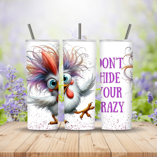 Three tumblers with a colorful rooster design and text on a wooden surface with a floral background.