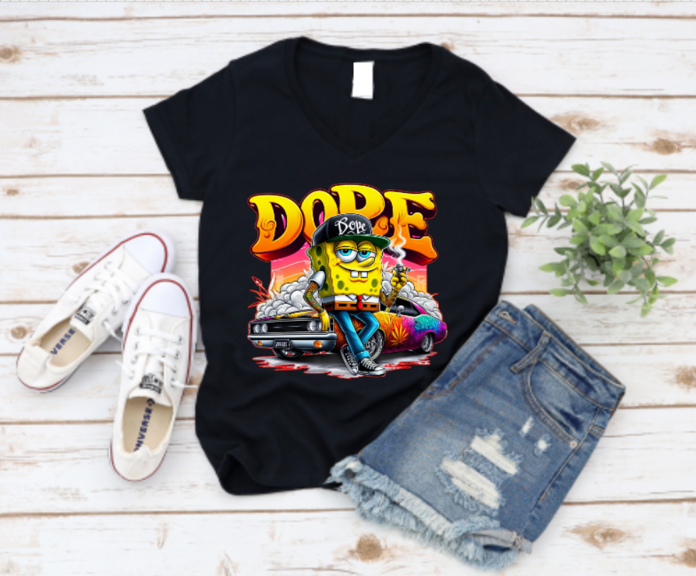 Black t-shirt featuring a bold “DOPE” graffiti-style design with a cartoon street character leaning on a muscle car, surrounded by smoke and neon colours – perfect for urban fashion and hip-hop style lovers.