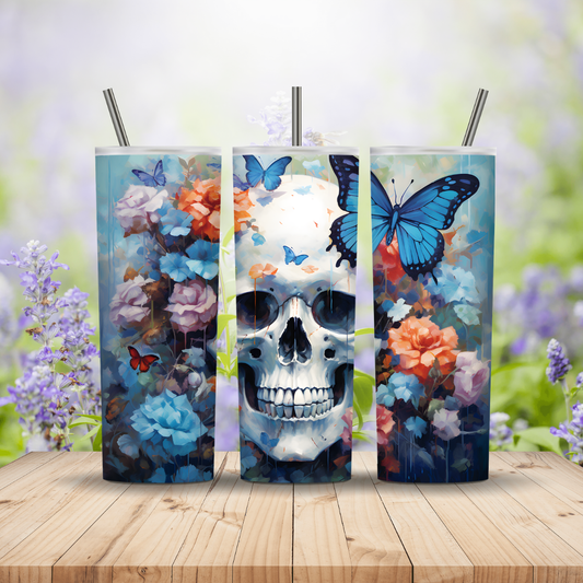 Three tumblers with skull and floral design on a wooden surface with a blurred floral background