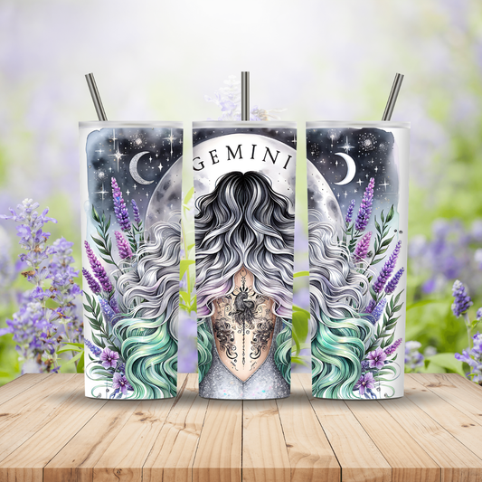 Two tumblers with a design of a woman's face, hair, and tattoos, surrounded by flowers on a wooden surface.