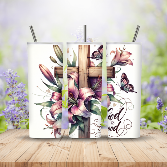 Three tumblers with floral and cross design on a wooden surface with blurred flowers in the background Miss Mafia