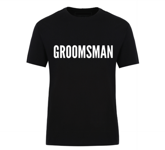 Black unisex t-shirt with the word “Groomsman” printed in bold font – ideal for wedding parties and bachelor celebrations.