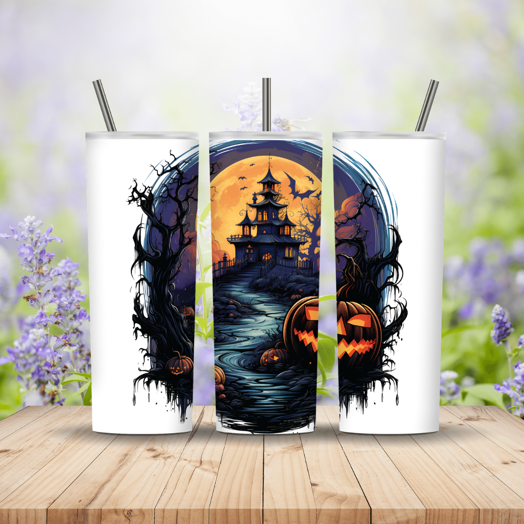 Three Halloween-themed tumblers with pumpkins and a moonlit scene on a wooden surface.