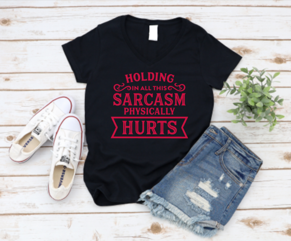 Black t-shirt with red text, white sneakers, and denim shorts on a wooden surface. www.missmafia.com