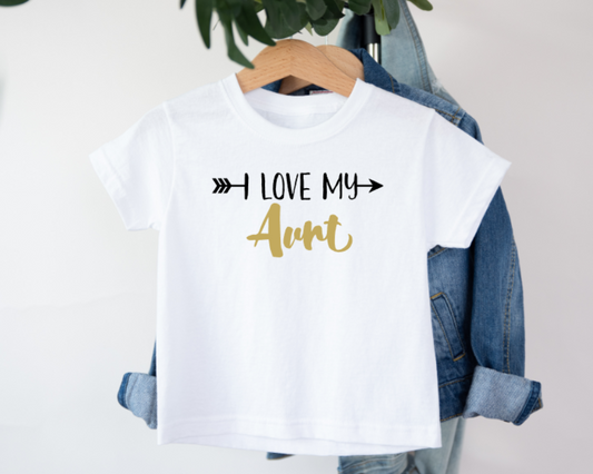 White t-shirt with 'I Love My Aunt' text on a hanger with denim jacket.