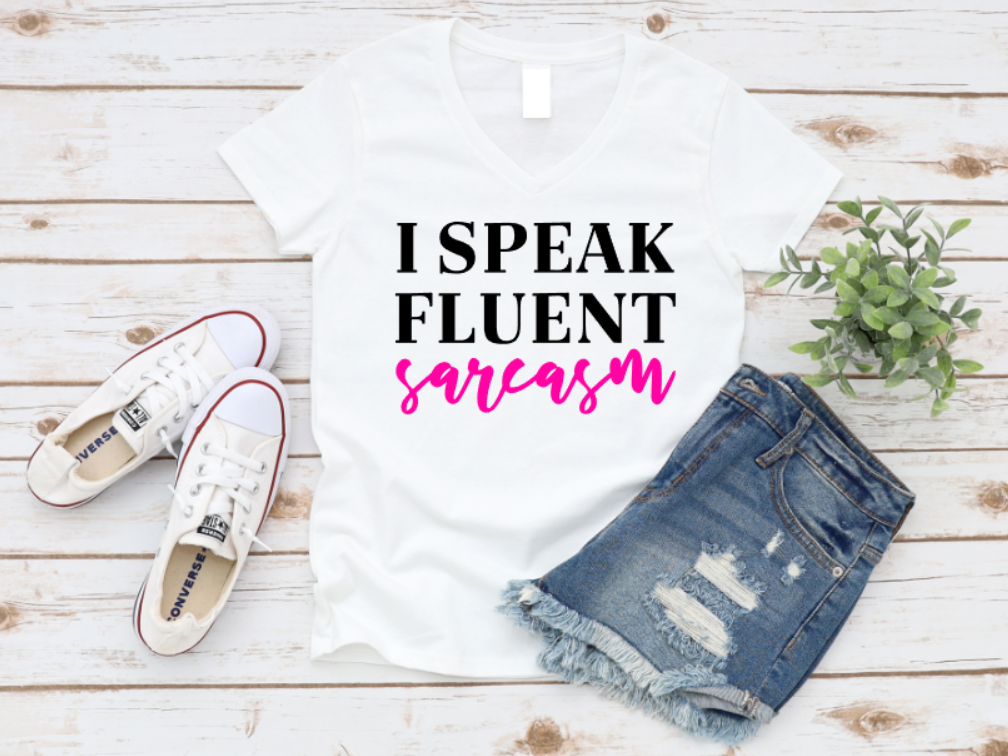 White unisex t-shirt with bold text that says “I Speak Fluent Sarcasm,” perfect for witty, sarcastic personalities who keep it real
