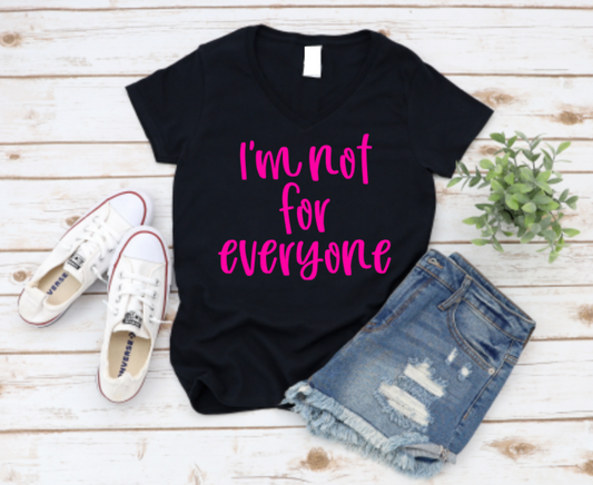 Black t-shirt with 'I'm not for everyone' text, paired with denim shorts and white sneakers on a wooden surface. www.missmafia.com