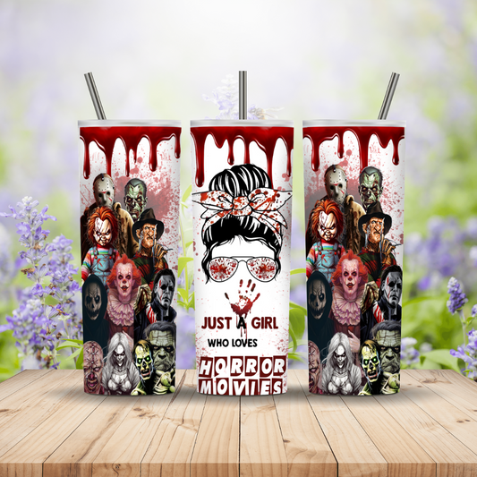 Three tumbler with horror movie characters and text on a wooden surface with a floral background