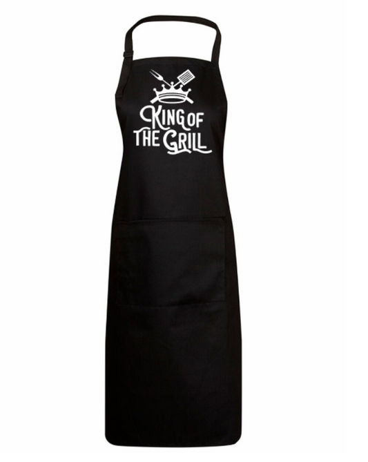 Black apron with 'King of the Grill' text on a white background