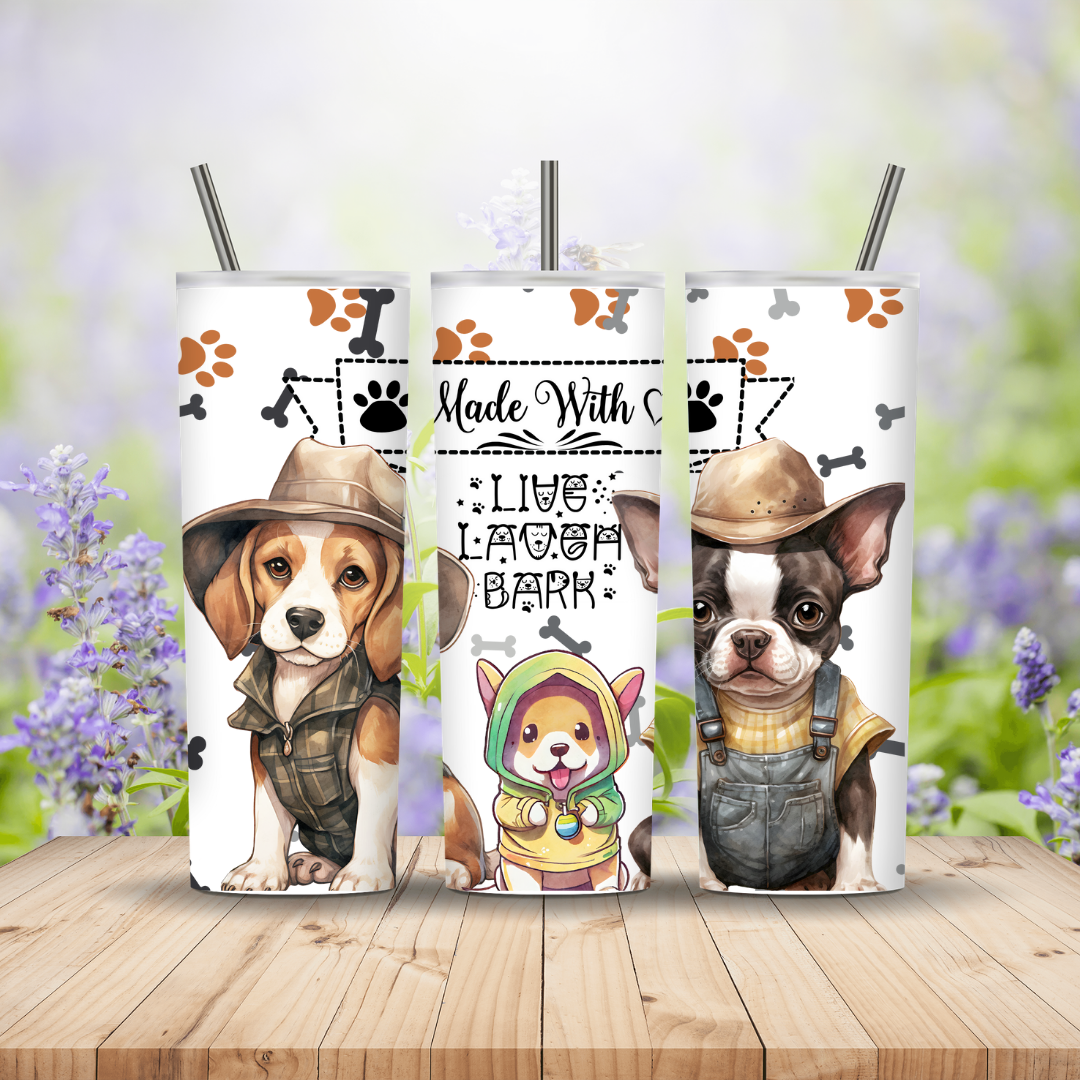 Three tumblers with dog illustrations and text on a wooden surface with a blurred floral background. Miss Mafia