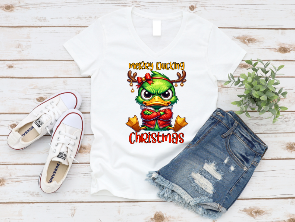 Unisex white t-shirt with “Merry Ducking Christmas” text and a grumpy cartoon duck wearing a Santa hat, designed for those who love sarcastic holiday humor.