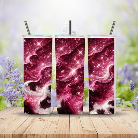 Three pink and white abstract design tumblers with straws on a wooden surface with a blurred floral background.
