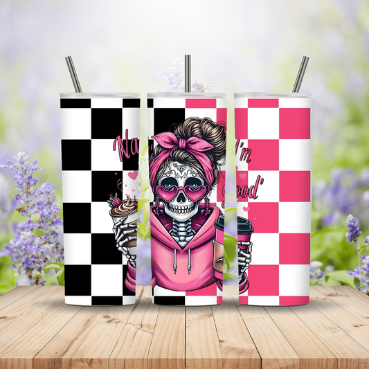Three tumblers with a checkered design and skeleton wearing a pink hoodie on a wooden surface with a blurred floral background.