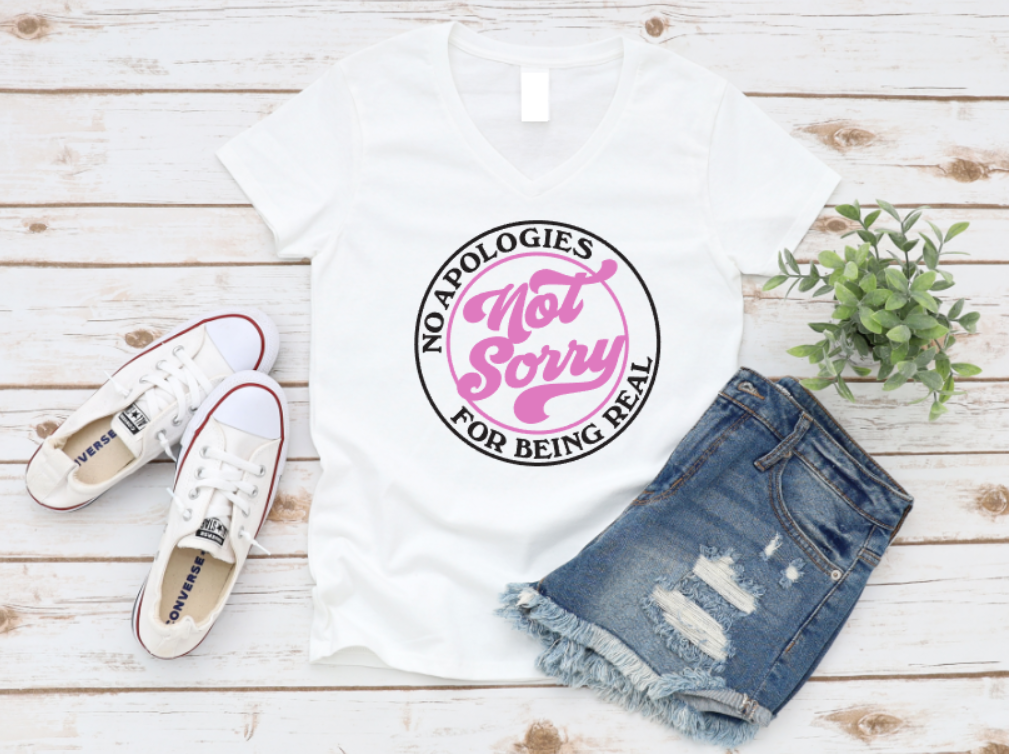 White t-shirt with pink and black text, white sneakers, and denim shorts on a wooden surface. www.missmafia.com