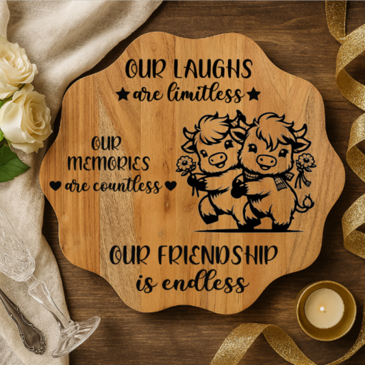 Wooden plaque with engraved text and illustrations of two animals, surrounded by flowers and a candle.