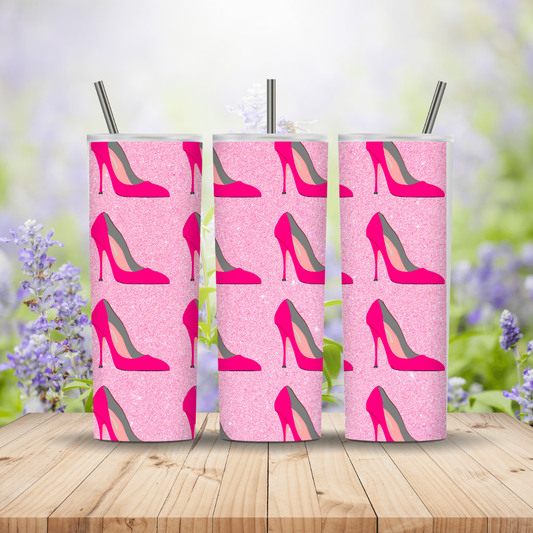 Three pink tumblers with high heel shoe pattern on a wooden surface with a blurred floral background Miss Mafia