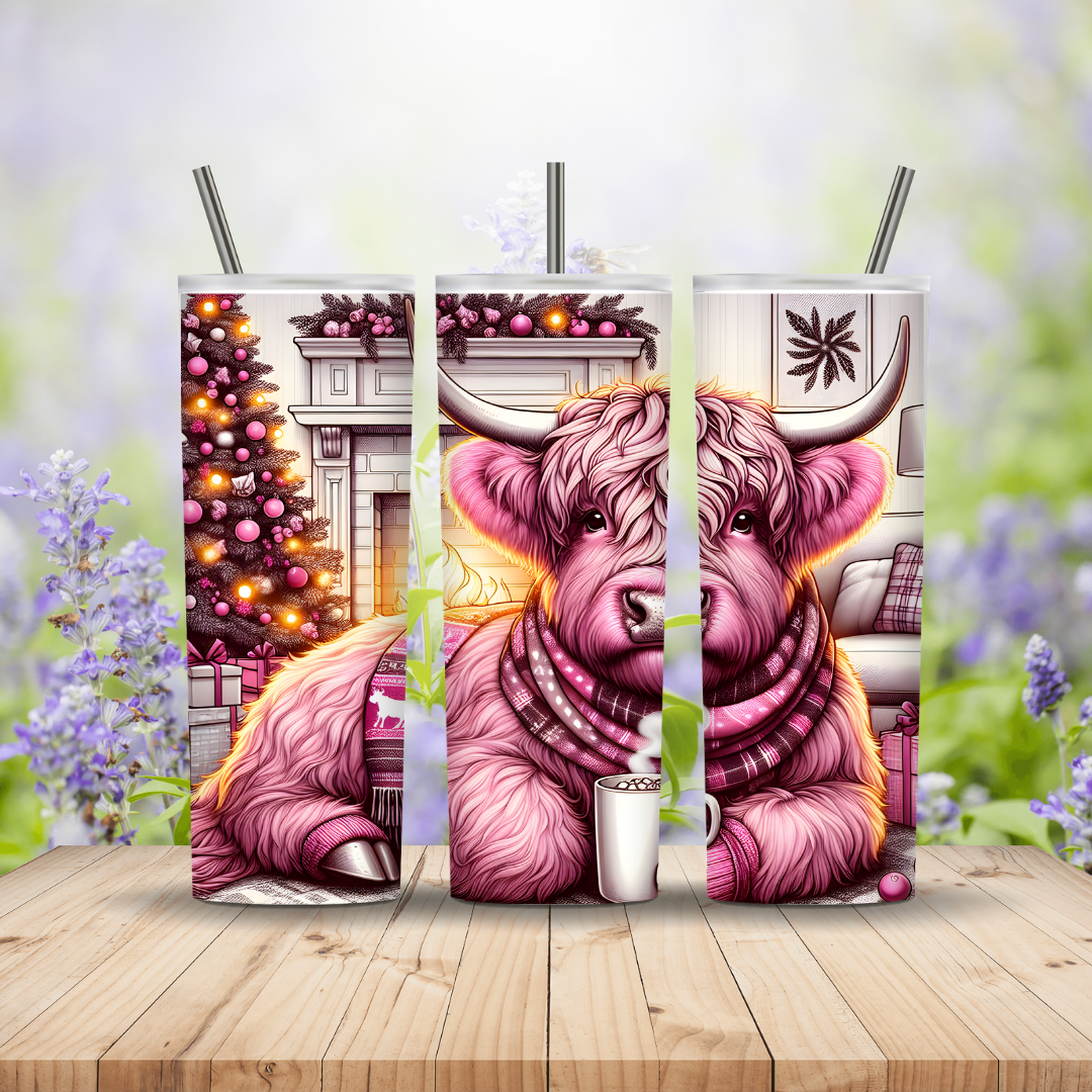 Pink Highland Cow sipping hot chocolate in front of a fire place and a christmas tree