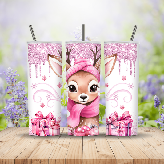 Three tumblers with a cartoon deer wearing a pink headband and scarf on a wooden surface with a floral background.