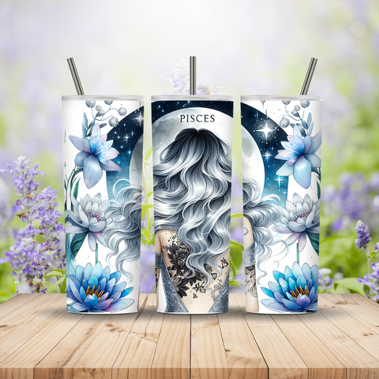Three tumbler with zodiac design featuring Pisces on a wooden surface with flowers in the background
