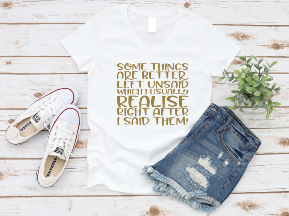 White t-shirt with printed text, denim shorts, white sneakers, and a plant on a wooden surface. www.missmafia.com