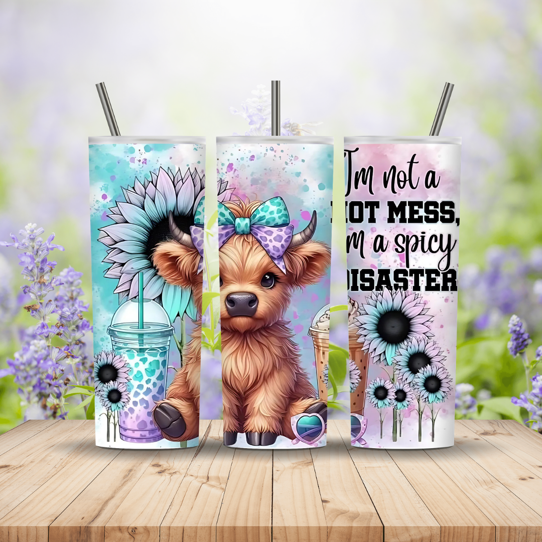 Three colorful tumblers with animal designs and text on a wooden surface with a floral background.