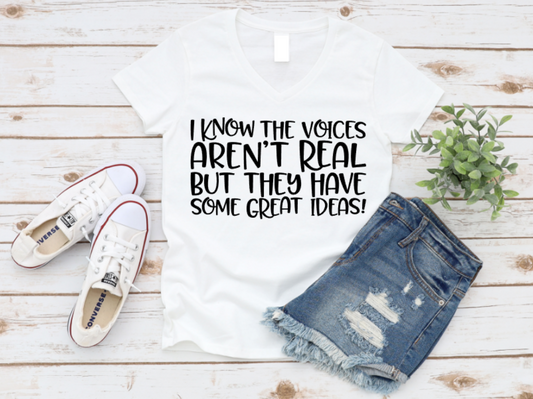 White t-shirt with text, denim shorts, and white sneakers on a wooden surface. www.missmafia.com