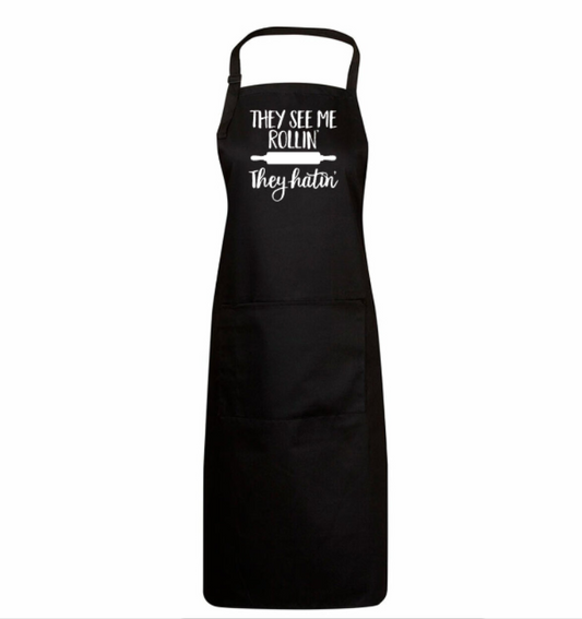 Black apron with white text on a white background
