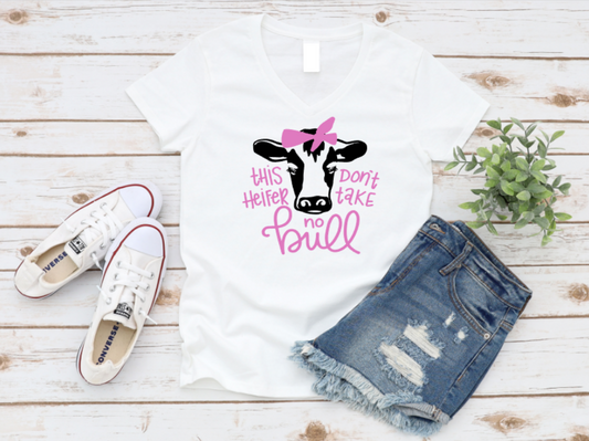 White t-shirt with cow graphic and text, paired with denim shorts and white sneakers on a wooden surface. www.missmafia.com