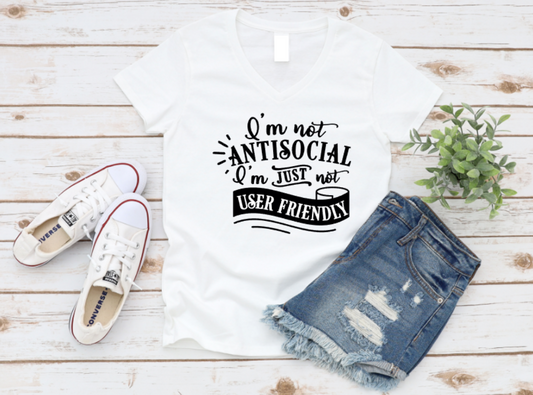 White t-shirt with humorous text design, paired with denim shorts and sneakers on a wooden surface. www.missmafia.com