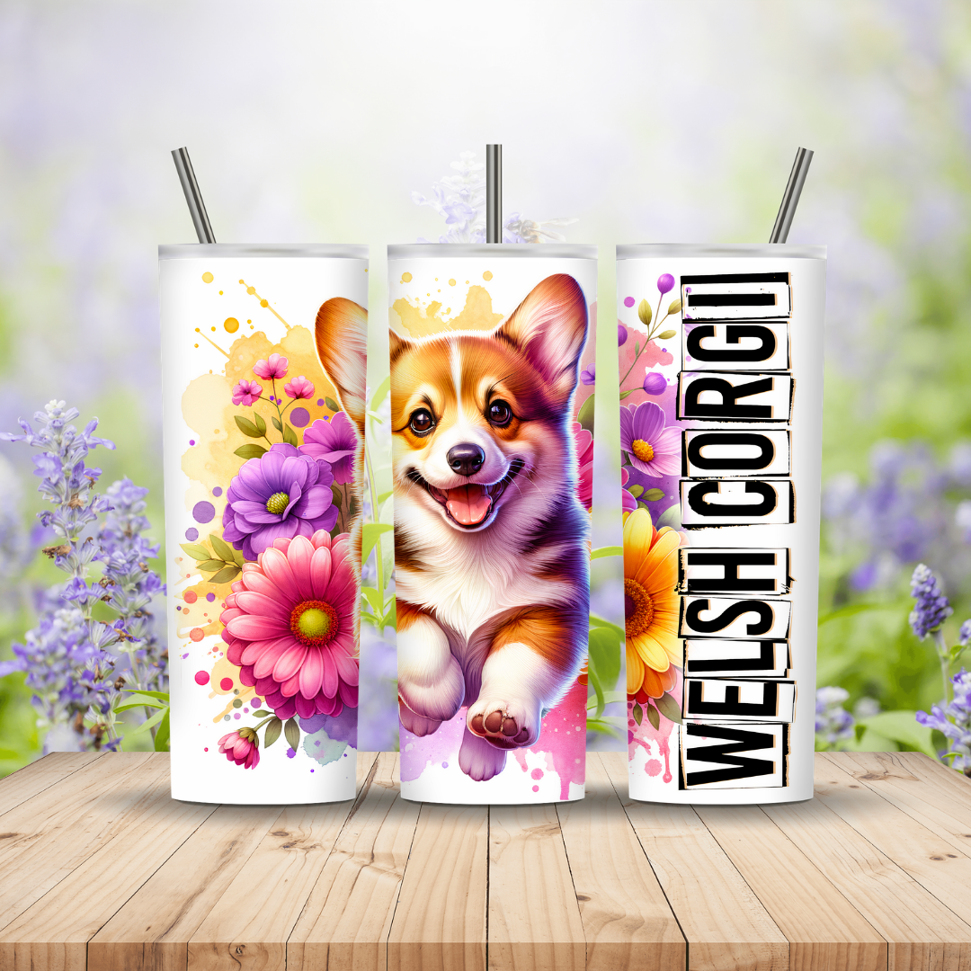 Three tumblers with a corgi design and floral elements on a wooden surface with a blurred floral background.