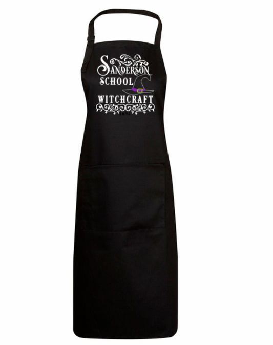 Black apron with 'Sanderson School of Witchcraft' text on a white background