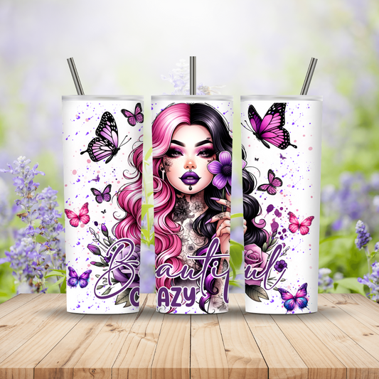 Three tumblers with a design of a woman with pink hair and butterflies on a floral background.