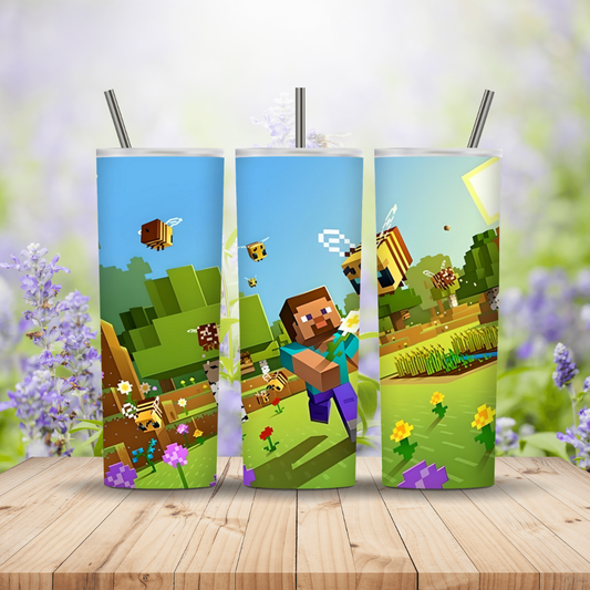 Three colourful tumblers with Minecraft-themed designs on a wooden surface. Miss Mafia