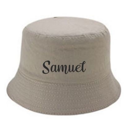 Beige bucket hat with 'Name' printed on it and the hat is on a white background