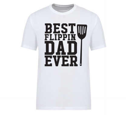 White t-shirt with bold text “Best Flippin’ Dad Ever” featuring a spatula icon – ideal for dads who dominate the grill.