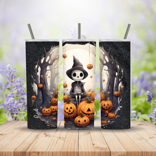 Three Halloween-themed tumblers with a skeleton and pumpkins design on a wooden surface.