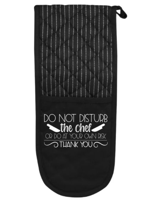 Black oven mitt with white text on a white background