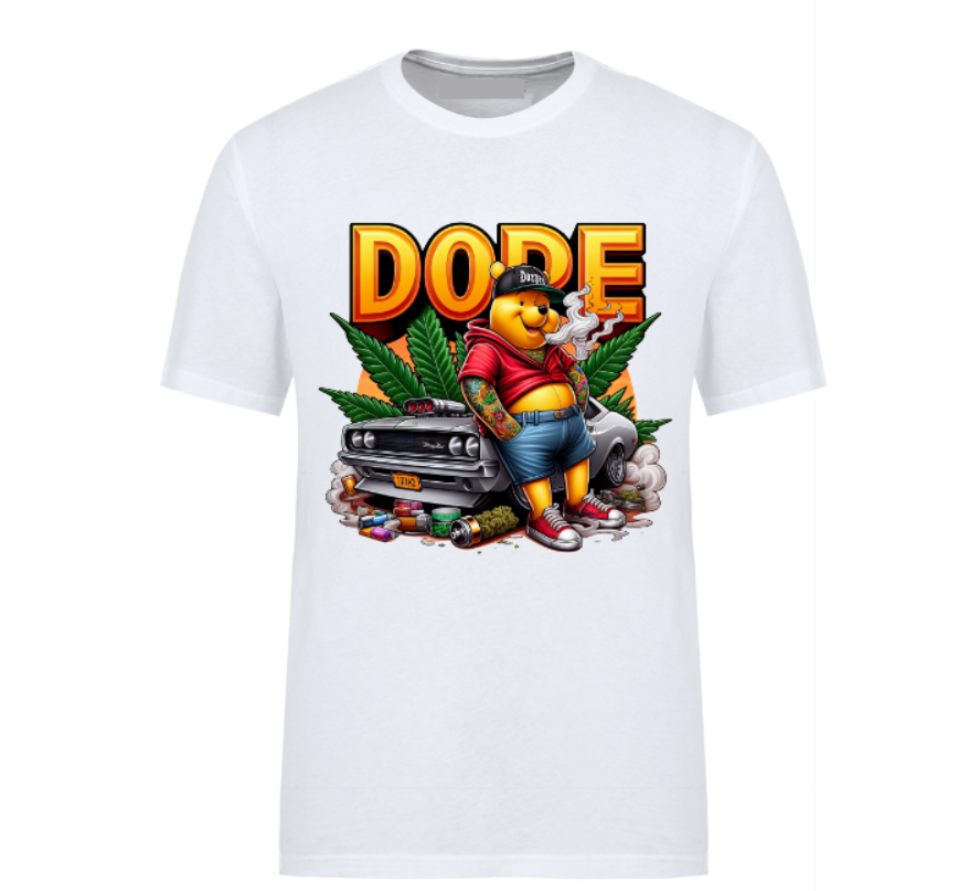 White t-shirt featuring a bold 'DOPE' graphic with a tattooed bear in streetwear, leaning against a muscle car surrounded by smoke, weed leaves, and urban details.