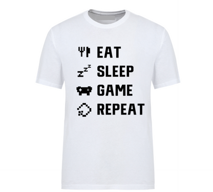 White t-shirt with white pixel-style text reading "Eat Sleep Game Repeat" alongside gaming and sleep icons, perfect for gamers.