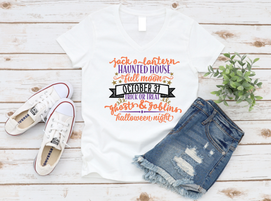 Halloween-themed t-shirt with text, denim shorts, and white sneakers on a wooden surface. www.missmafia.com